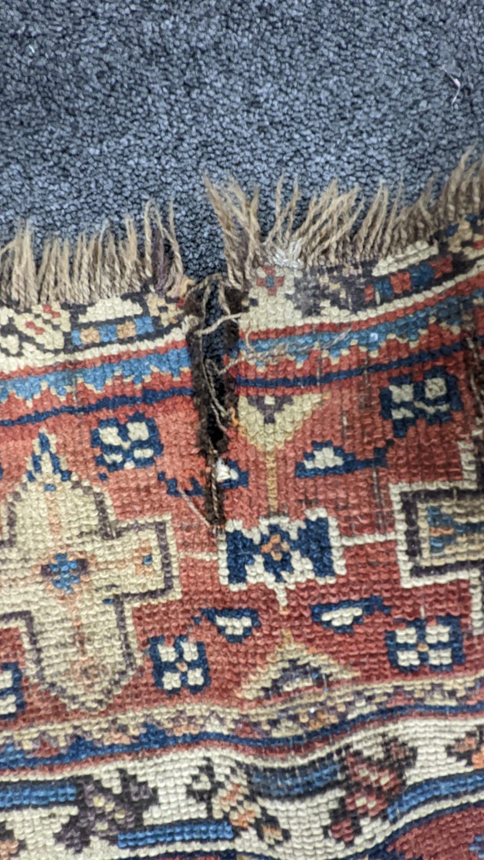 A pair of antique Caucasian blue ground rugs, 290 x 132cm